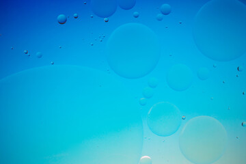 Colorful artistic image of oil drop on water for modern and creation design background.