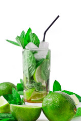Cocktail mojito with mint leaves, lime and ice isolated on a white background.