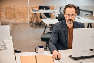 Man is analyzing financial data at office