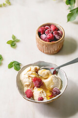 Caramel ice cream with raspberries