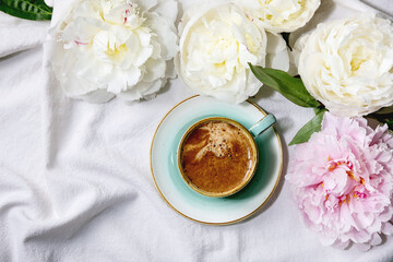 Coffee and peonies flowers