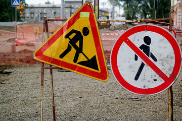 road signs denoting roadworks and prohibiting passage, road repairs