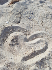 Heart in the sand. Hand drawn. A symbol of love.
