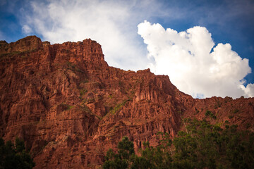 Brown and Red Stone Hill with Blue Cloudy Sky in La Paz / Bolivia