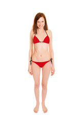 Portrait of a barefoot young woman wearing a red bikini, isolated on white studio background