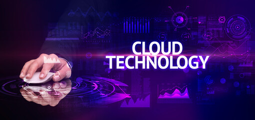 hand holding wireless peripheral with CLOUD TECHNOLOGY inscription, modern technology concept