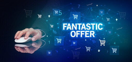 hand holding wireless peripheral with FANTASTIC OFFER inscription, online shopping concept
