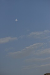 Moon and cloud on blue sky.