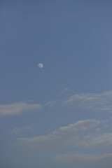 Moon and cloud on blue sky.