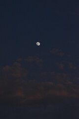 Moon and cloud on blue sky.