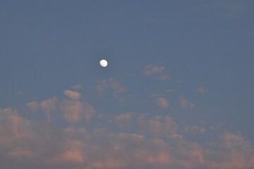 Moon and cloud on blue sky.