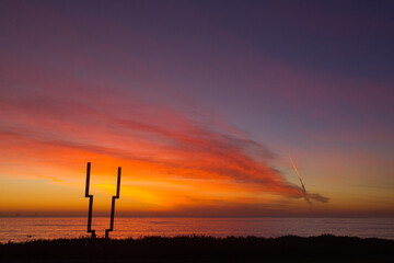 Missile launch at sunset from Vandenberg Air Force base in California