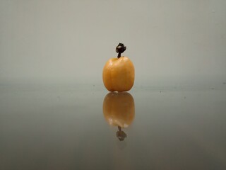 Yellow fruit on glass table top