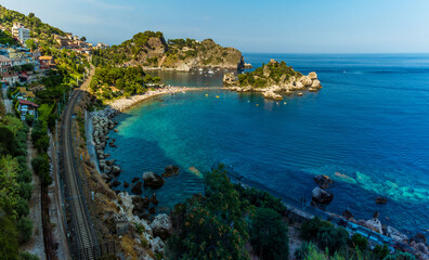 A close-up view of the shoreline and Isola Bella near Taormina, Sicily in summer
