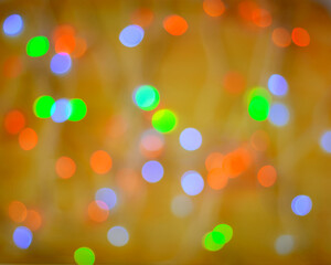 Multi-colored abstract blurred shiny background. Bright confetti glitter. Festive Christmas glowing background