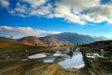 Fototapeta na wymiar Himalayan valley landscape with road near Kunzum La pass, Spiti Valley, India.