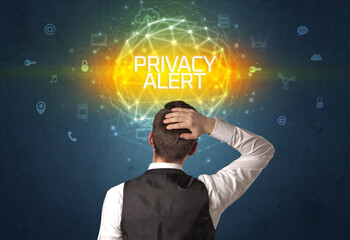 Rear view of a businessman with PRIVACY ALERT inscription, online security concept