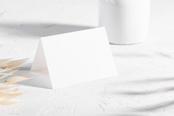 Mockup template with dry plants flower and perfume and design element design for wedding rsvp, thank you card, greeting or place card