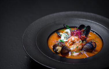 Delicious mediterranean seafood soup with mussels and prawns