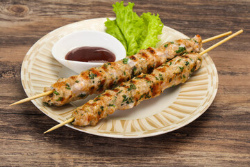 Minced pork skewer kebab with sauce
