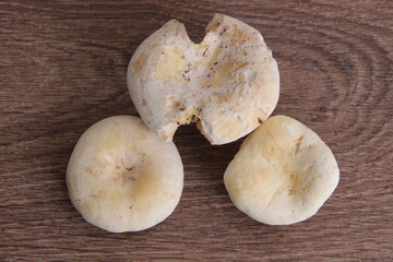 3 white forest bunches on a wooden background, top view