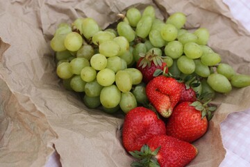 Croissants strawberries and grapes on a picnic
