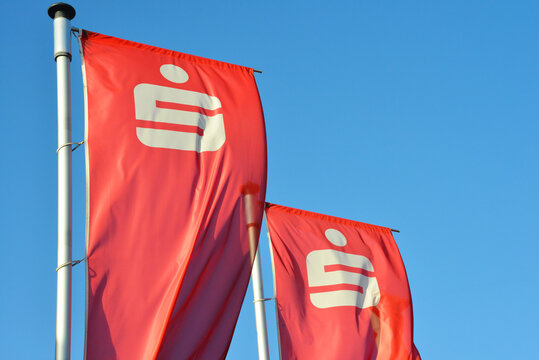 Winsen, Lower Saxony / Germany - December 06, 2015: Flags with the Logo of the german Savings Bank - Sparkasse - in front of a branch in Winsen, Germany