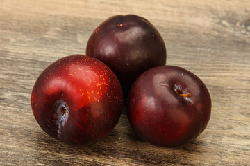 Ripe sweet plum fruit heap