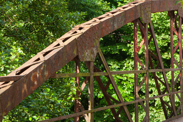 closeup of an old, rusty bridge span