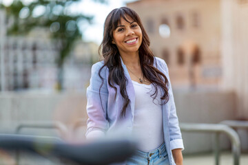 Attractive young woman smiling in the city
 - Powered by Adobe
