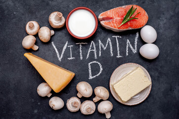 Vitamin D rich foods on stone background.