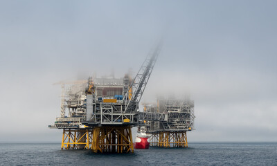 Fototapeta premium Offshore vessel at oil platform