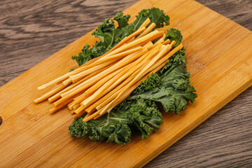 Chechel cheese sticks over board