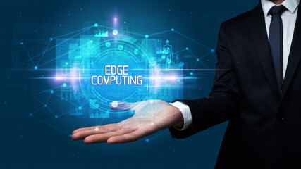 Man hand holding EDGE COMPUTING inscription, technology concept
