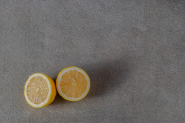 Cut lemon on a gray  background