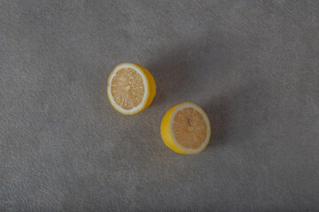 Cut lemon on a gray  background