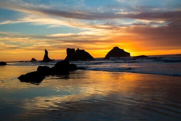 Face Rock and other sea stacks at sunset at Bandon beach on the southern Oregon Coast at Bandon.