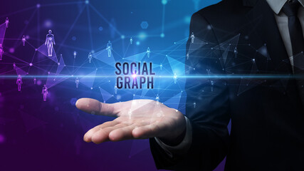 Elegant hand holding SOCIAL GRAPH inscription, social networking concept