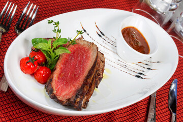 Medium Grilled bbq steaks and savory tomato sauce. As backdrop for menus, cookbooks, advertisements and other culinary projects
