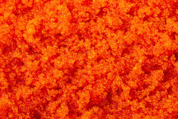 Fresh red trout caviar macro background. As backdrop for menus, cookbooks, advertisements and other culinary projects