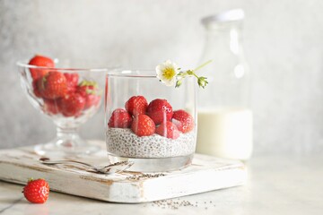 Overnight chia pudding with fresh strawberry. Superfood, low carb, plant based concepts.