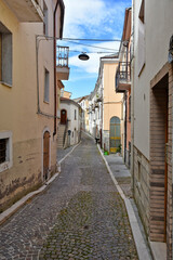 Fototapeta na wymiar A street between the houses of the old town of Santa Maria del Molise, Italy.