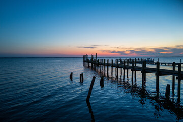 Fototapeta na wymiar Sunset over a Fishing Pier