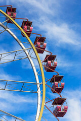 Ferris wheel against a blue sky on a sunny day