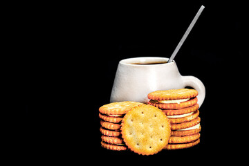 lemon-filled biscuits with a rustic ceramic cup behind