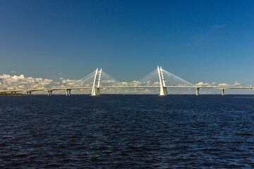 Large white cable-stayed bridge across the strait