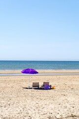 Fototapeta na wymiar beach with umbrella and chairs