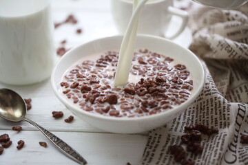 Milk is poured into chocolate balls