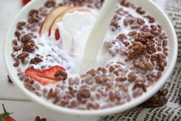 Milk is poured into chocolate balls