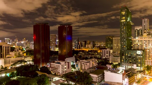 BANGKOK, THAILAND - JUNE 6 2020: Timelapse view of traffic and city lights in central Bangkok from a tall building at night.  Bangkok is famous for having some of Asia's worst traffic congestion.